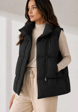 Short quilted vest with stand collar