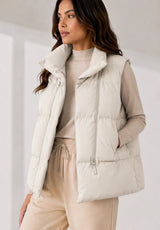 Short quilted vest with stand collar
