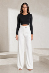 High-waisted flowing trousers with crossover belt
