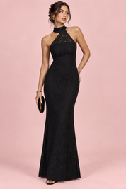 Robe longue en dentelle noire à encolure asymétrique et détail de col | Vue de face | Lounelle Paris