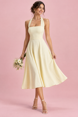 Light yellow fit-and-flare midi dress with a square neckline