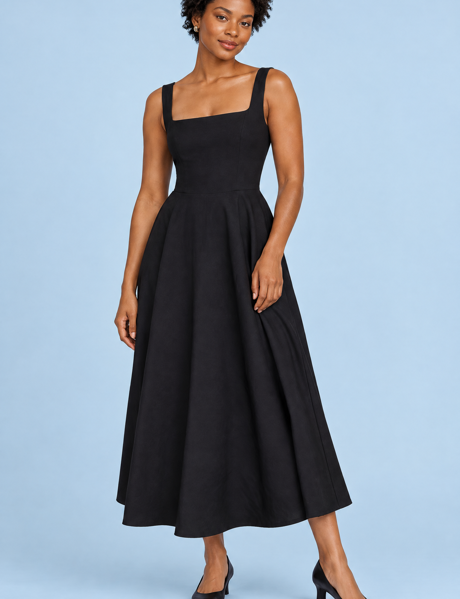 Robe midi noire à fines bretelles et ourlet ample | Vue de face | Lounelle Paris
