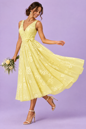 Robe midi fleurie jaune à la coupe patineuse | Vue de dos | Lounelle Paris